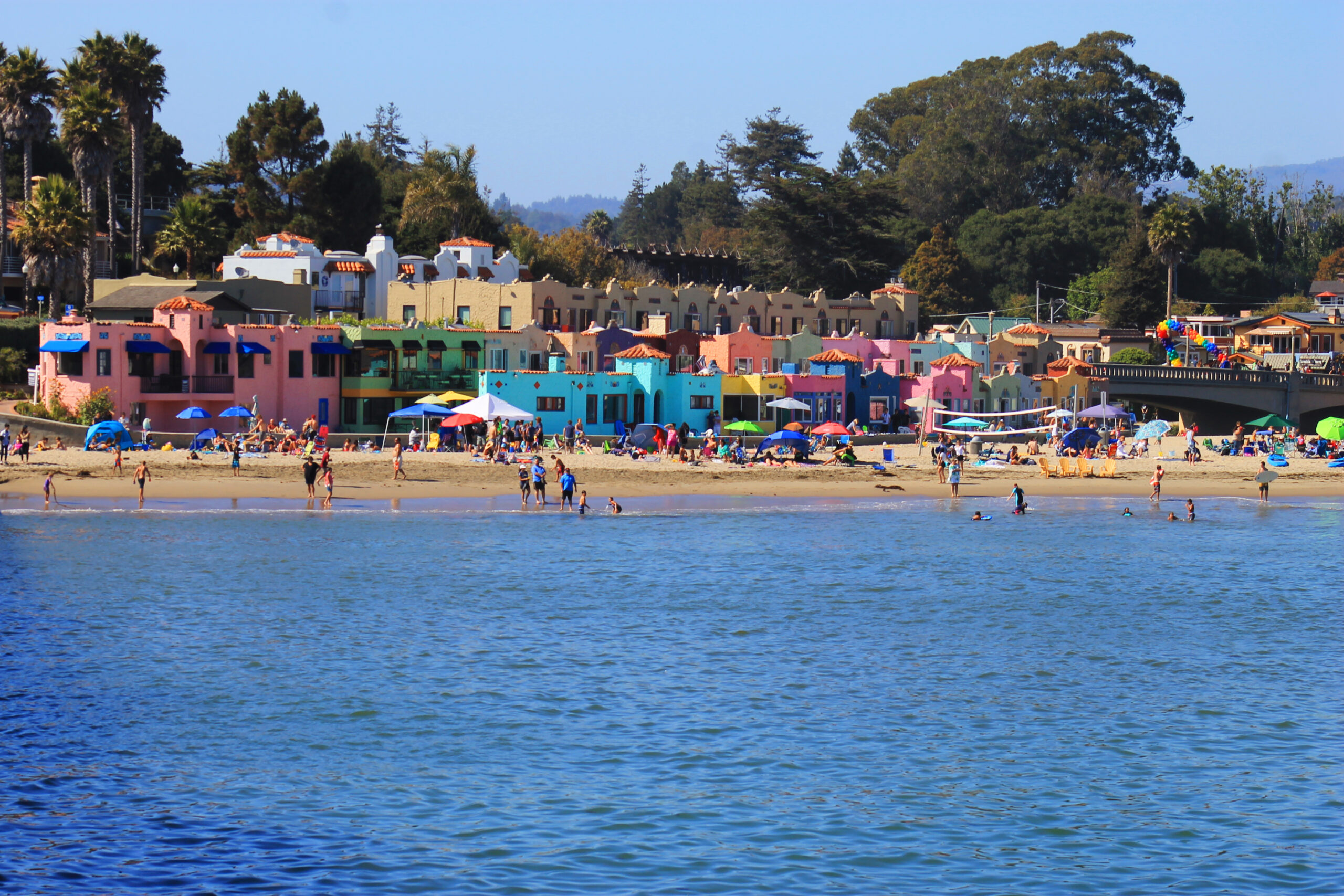 The Venetians beachfront hotel overlooking Capitola Beach and colorful village buildings