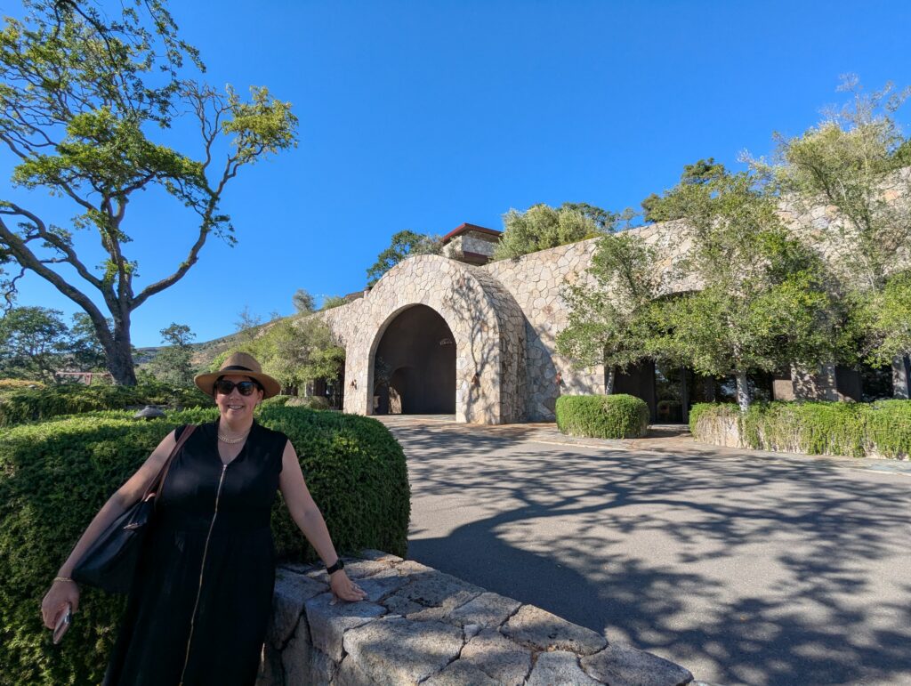 Entrance to Palmaz Vineyards estate in Napa Valley surrounded by hillside vineyards